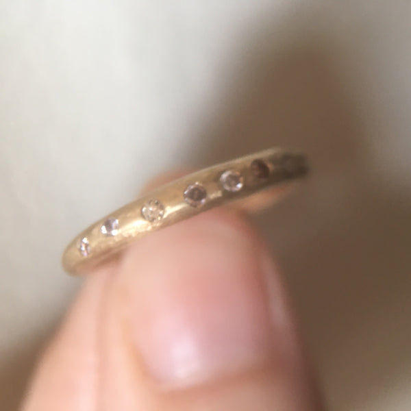 thin tapered band with six fine diamonds