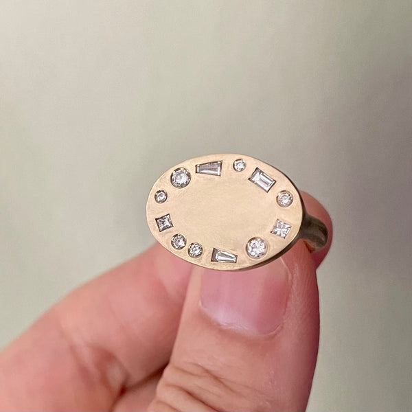 oval halo studded signet